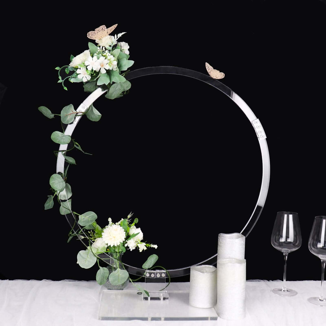 Acrylic circle display with flowers and butterflies, elegant decor piece.