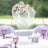 Elegant floral centerpiece with cascading crystals for wedding decor.