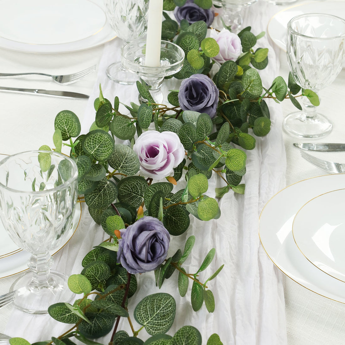 Elegant floral table runner with lavender roses and greenery for dining decor.