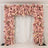 Floral archway adorned with pink and cream roses against a white backdrop.