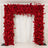 Red floral archway adorned with vibrant roses and blooms against a white backdrop.