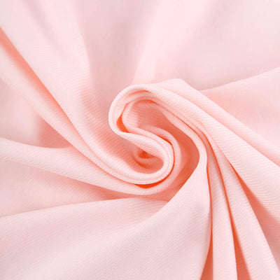 Soft pink fabric texture close-up showcasing a smooth, flowing design.