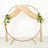 Round wedding arch with draped fabric and floral accents