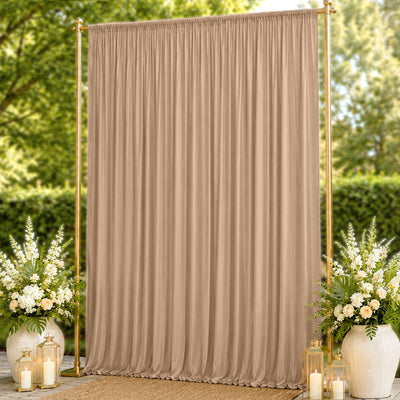 Beige draped wedding backdrop with gold frame and floral arrangements