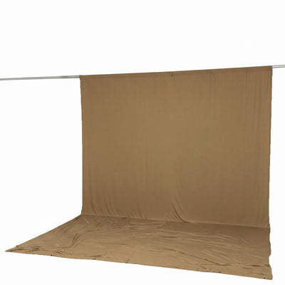 Beige fabric backdrop on crossbar with floor sweep, studio photo background