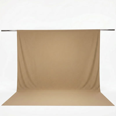 Beige photography backdrop with seamless paper on studio support rod#whtbkgd