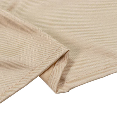 Beige ribbed cotton fabric close-up with folded hem