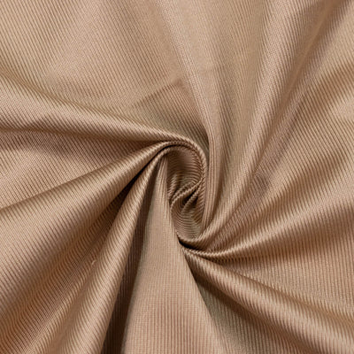 Beige ribbed fabric texture with elegant swirl folds