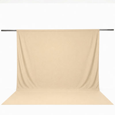 Beige seamless backdrop curtain on a support rod for photography#whtbkgd