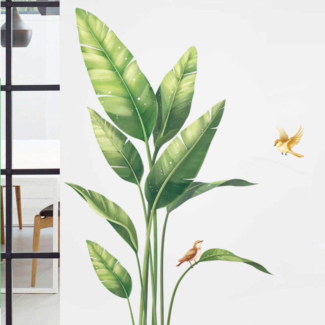 Leafy wall mural with birds in a bright, modern interior setting.