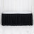 Black banquet table with white top and black pleated table skirt on white backdrop