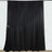 Black sheer curtain with draped design and floral accent.