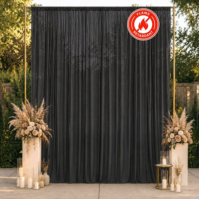 Black flame retardant curtain backdrop with elegant wedding floral decor