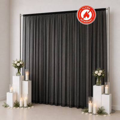 Black flame-retardant sheer curtain backdrop with wedding decor and candles