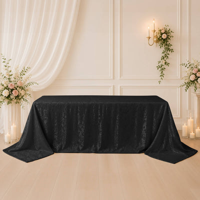 Black lace tablecloth on elegant floral wedding reception table setup