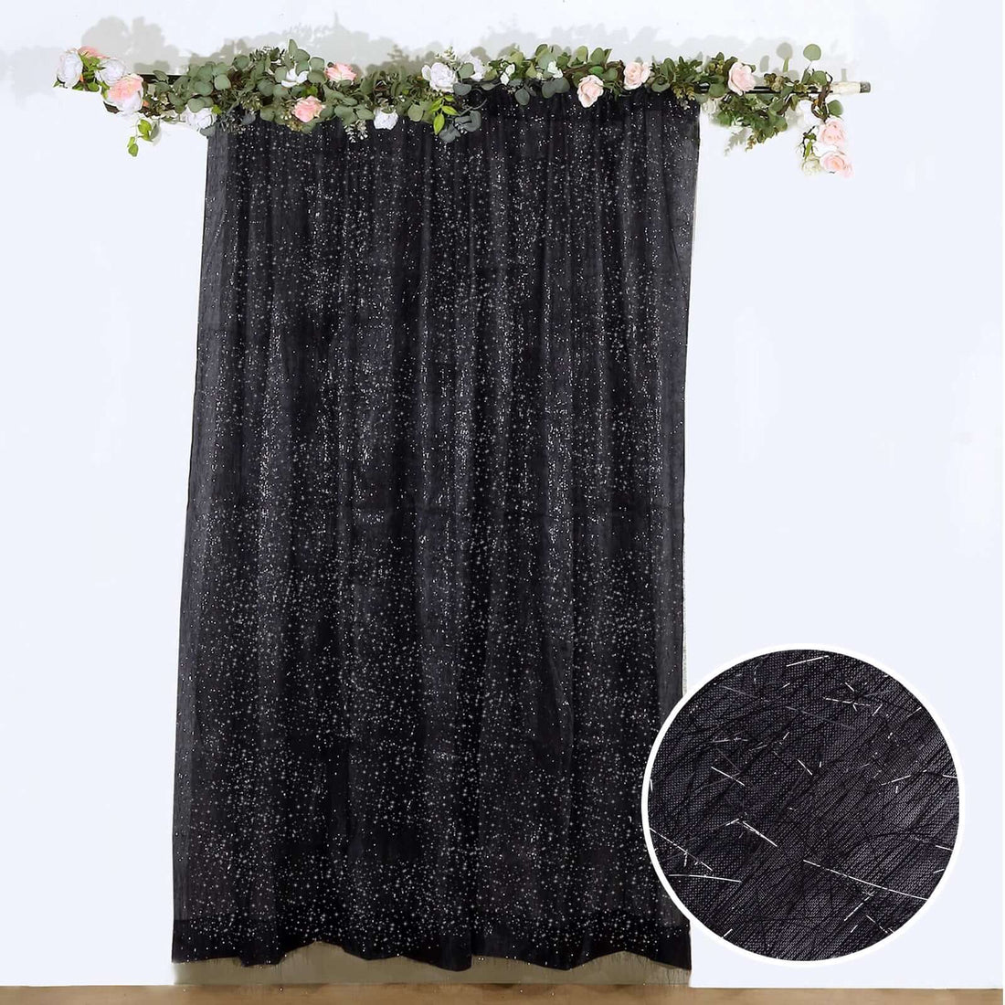 Black sheer curtain with star pattern, featuring close-up texture detail.