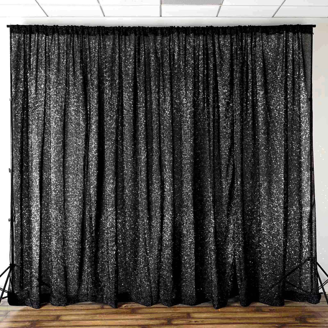 Black sequin backdrop curtain for events and photo shoots.