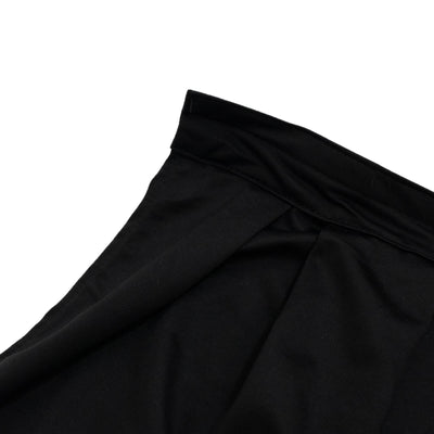 Black ribbed fabric skirt with elastic waistband on white background