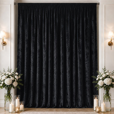 Black velvet blackout curtain in elegant room with floral decor and candles
