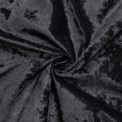 Black velvet fabric texture with soft folds and swirl pattern#whtbkgd