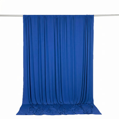 Blue fabric backdrop curtain on a hanging rod
