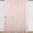 Pink sheer curtain panel with draped design and floral tieback