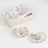 Floral porcelain tea set with matching cups and saucers in a decorative box.
