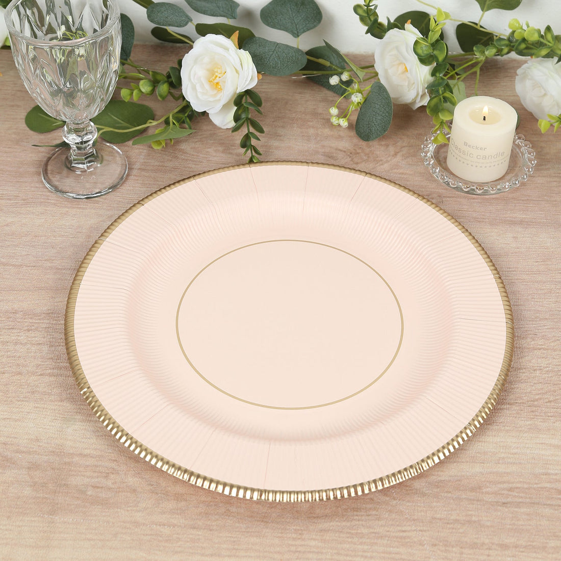 Elegant pink plate with gold rim, perfect for dining settings.