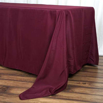 Add Elegance to Your Event with a Burgundy Seamless Polyester Rectangle Tablecloth