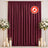 Burgundy flame-retardant curtain backdrop with floral stands and candles