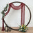 Decorative circular backdrop with draped fabric and floral accents.