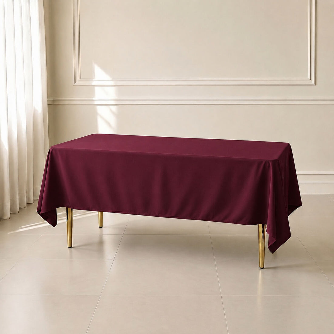 Burgundy wrinkle-resistant rectangle tablecloth 60"x102" on a table.