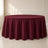 Burgundy round tablecloth draped elegantly on a table.
