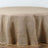 Round burlap tablecloth with a scalloped edge.