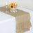 Burlap table runner with ruffled edges, glass, and floral centerpiece