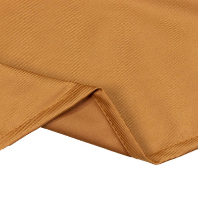 Camel ribbed knit fabric close-up with folded hem detail