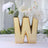 Gold letter W vase with flowers, perfect for decor or gifts.