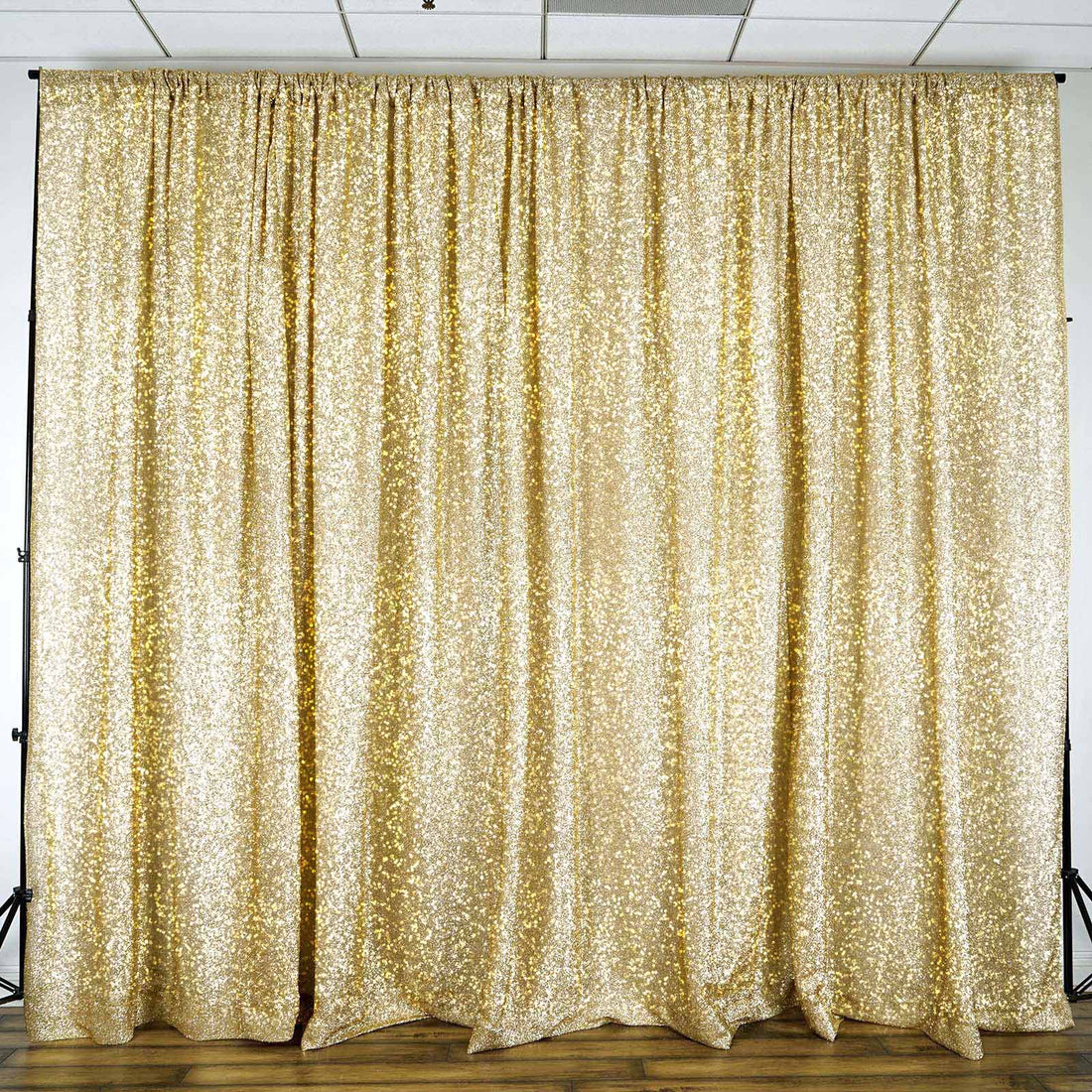 Gold sequin backdrop curtain for events and photography.