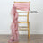 Pink satin chair sash with ruffled overlay on a gold chiavari chair.