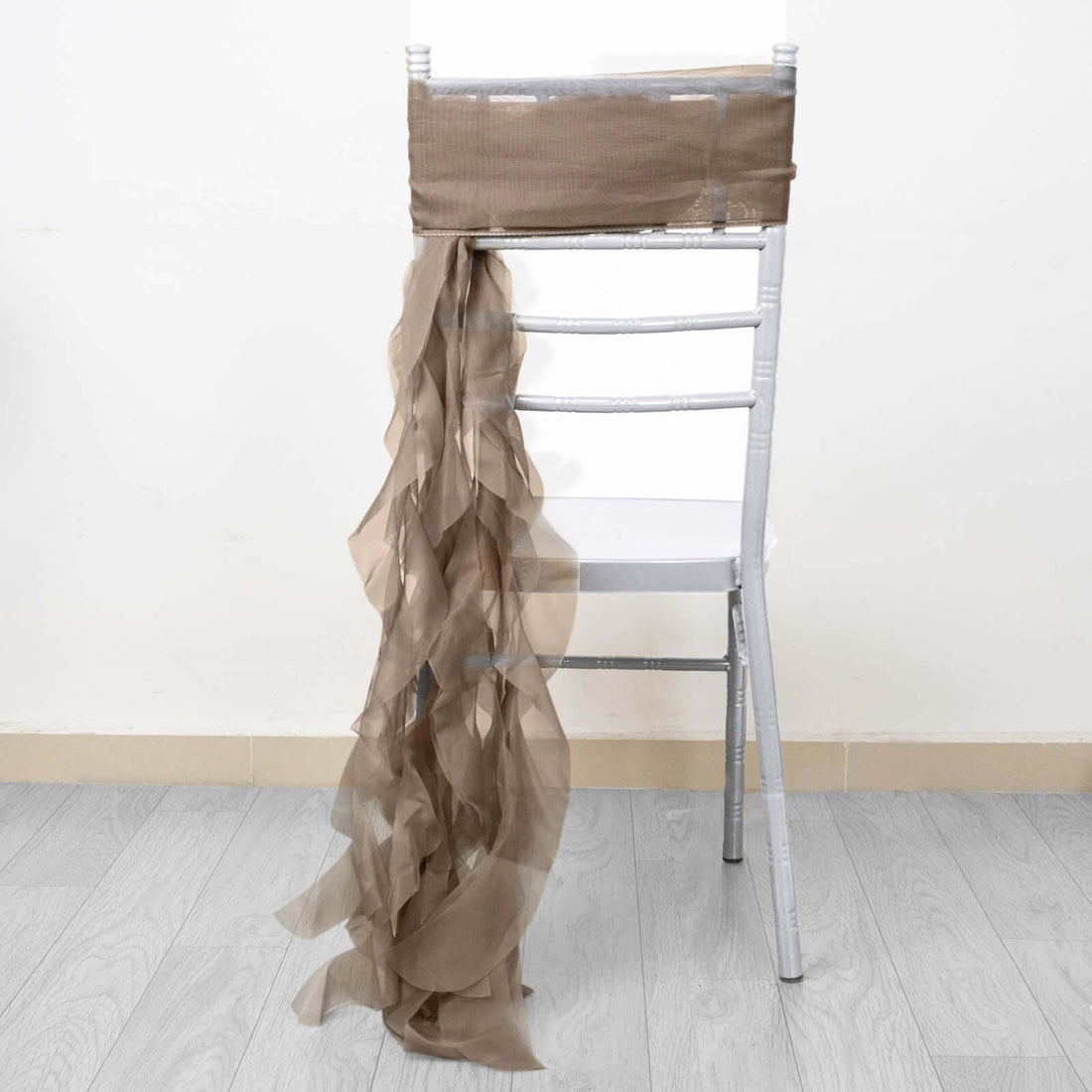 Elegant taupe chair sash draping gracefully over a chair.