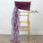 Gold chiavari chair with a purple satin sash draped on the back. Satin sash sold separately.