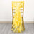 Yellow organza chair sash tied in a bow on a gold chair.