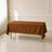 Cinnamon brown wrinkle-resistant tablecloth on a dining table.