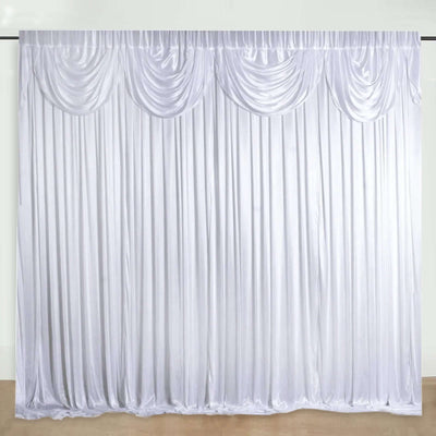 White satin drapery backdrop with elegant pleats and gathered top detail