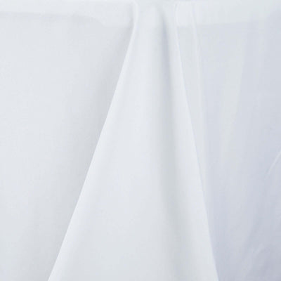 White tablecloth draped elegantly for a clean, minimalist look. #whtbkgd