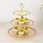 Three-tiered dessert stand with cupcakes and macarons.