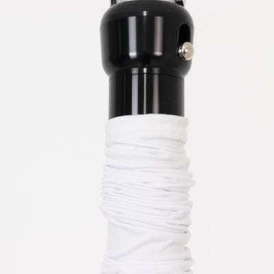 Black umbrella handle with white fabric grip on a plain backdrop.