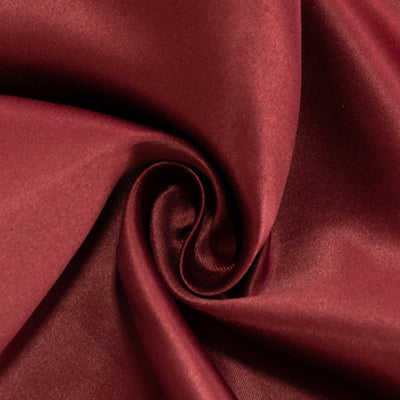 Burgundy satin fabric with smooth texture and elegant sheen. #whtbkgd