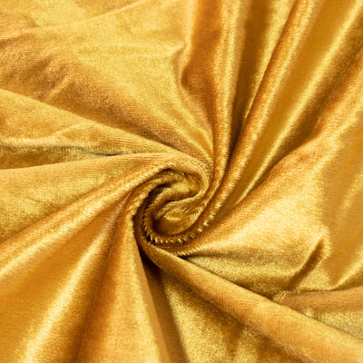 Close-up of luxurious gold satin fabric swirl texture#whtbkgd