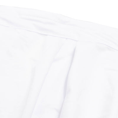 Close-up of white fabric folds with soft shadows and texture